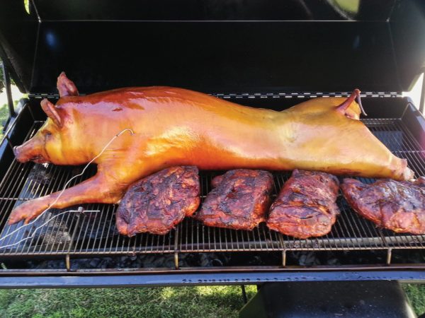 Whole Hog And Butts on Pig Roaster (Photo Credits: K. Johnson)